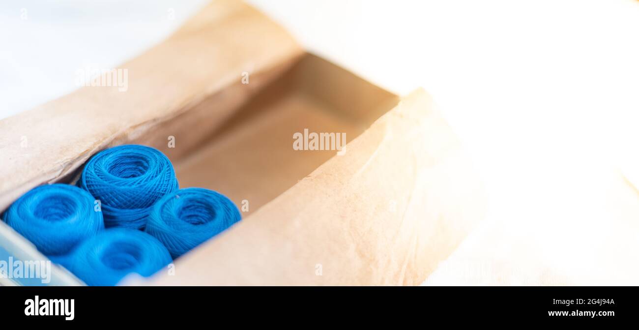 The dark blue color embroidery thread roll using in garment industry ...