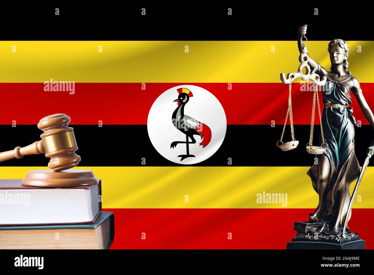 Law and justice in Uganda. Statue of themis and the gavel of the judge