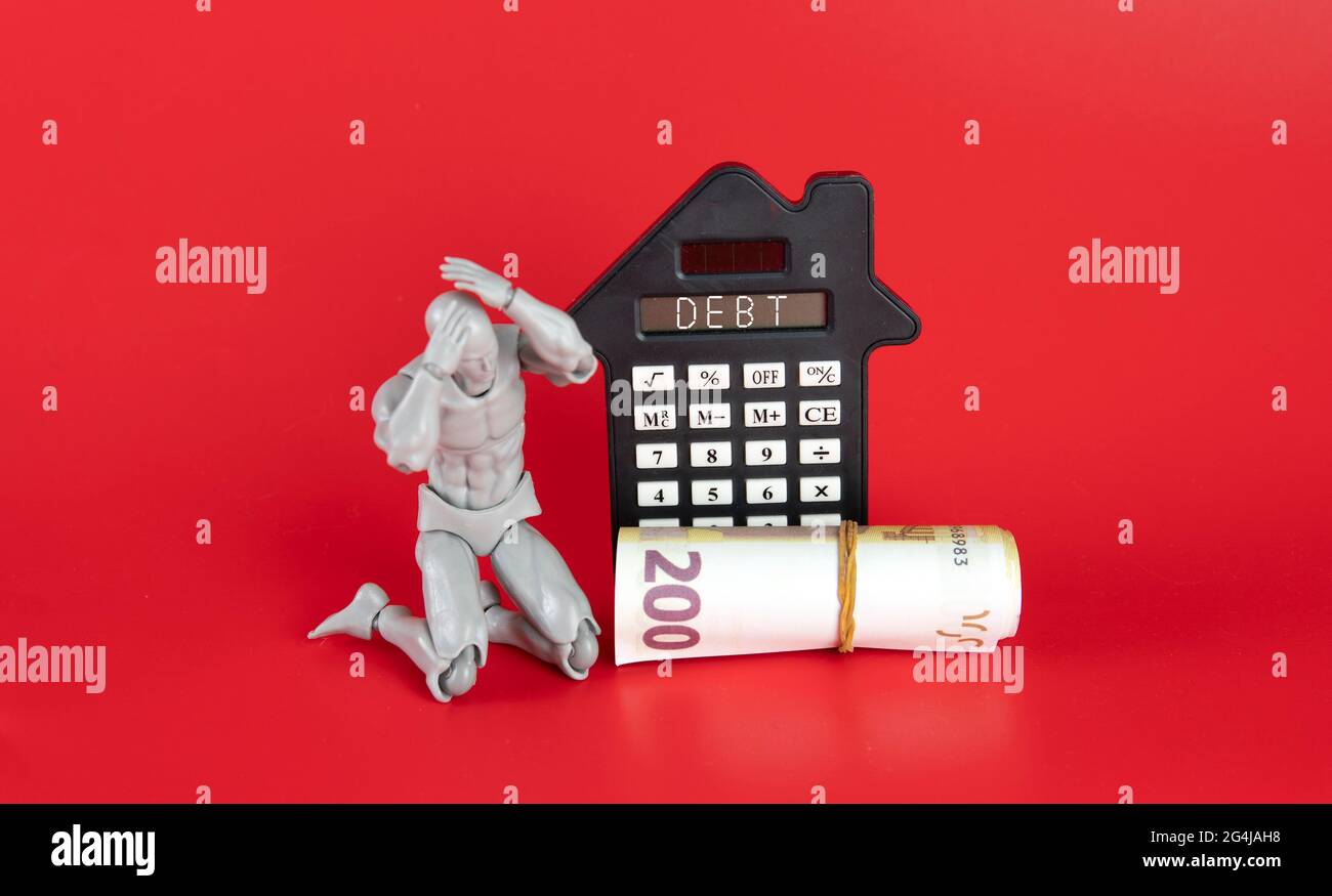 Debt Financial Concept. Toy people putting the hand on the head due to financial or debt problem. Stock Photo