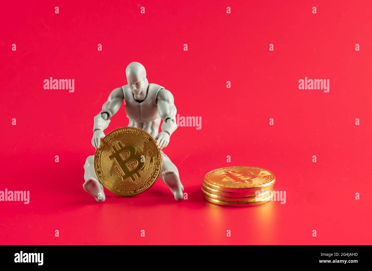 Bitcoin Cryptocurrency. Digital Currency of The Future. Selective focus of  a doll on the knee holding bitcoin replica Stock Photo - Alamy
