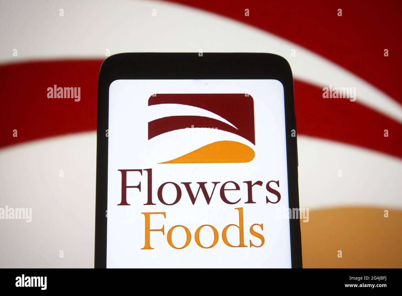 In this photo illustration a Flowers Foods logo of an US bakery company