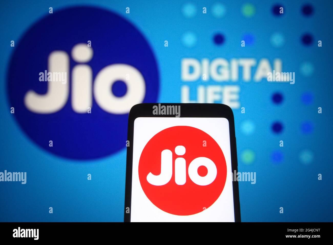 In this photo illustration a Jio (Reliance Jio Infocomm Limited) logo of an  Indian telecommunications company is seen on a smartphone and a pc screen.  (Photo by Pavlo Gonchar / SOPA Images/Sipa
