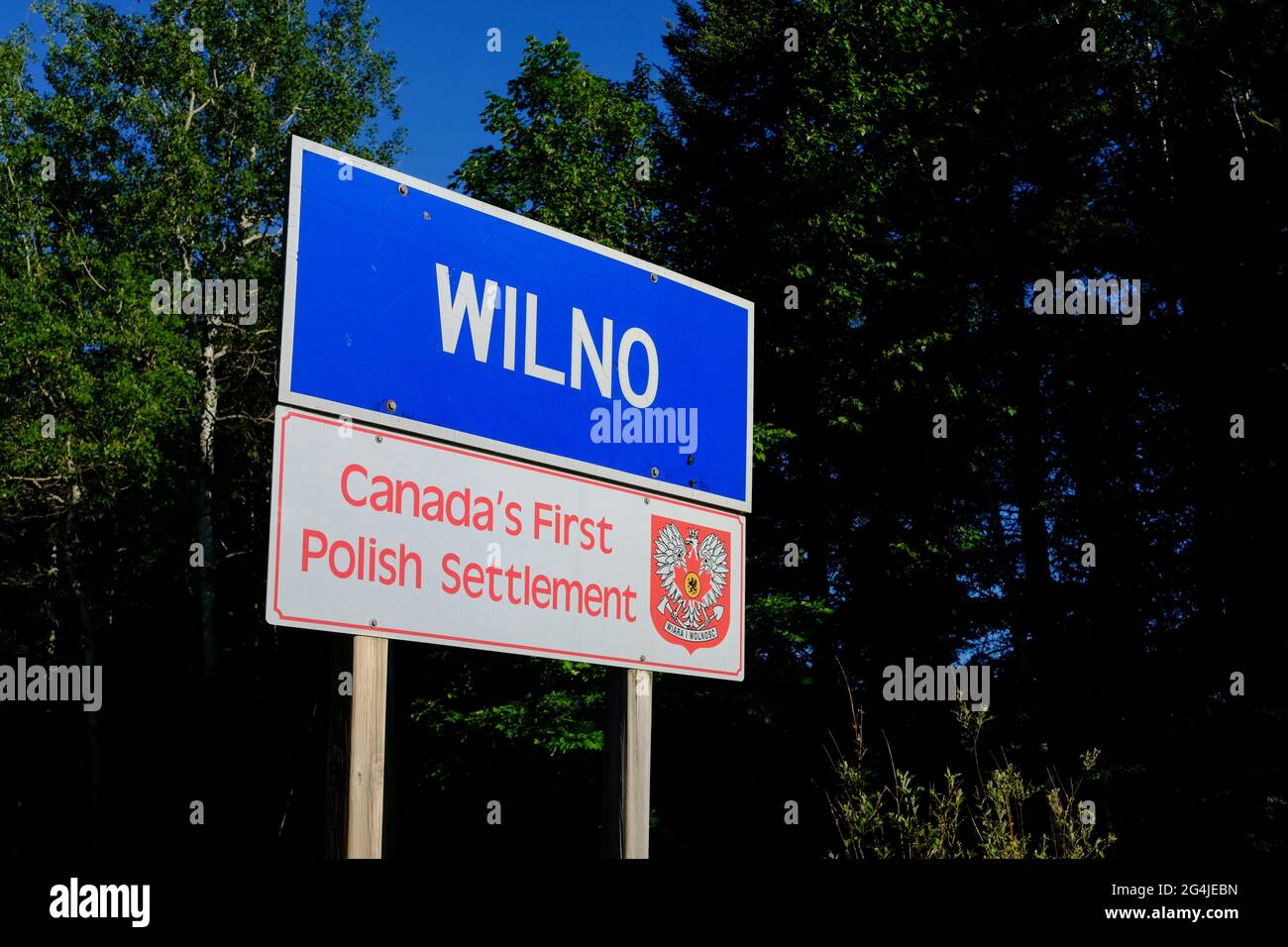 Wilno, Ontario, Canada - June 16, 2021: A sign along Highway 60 labels Wilno as the site of Canada's first Polish settlement. Stock Photo