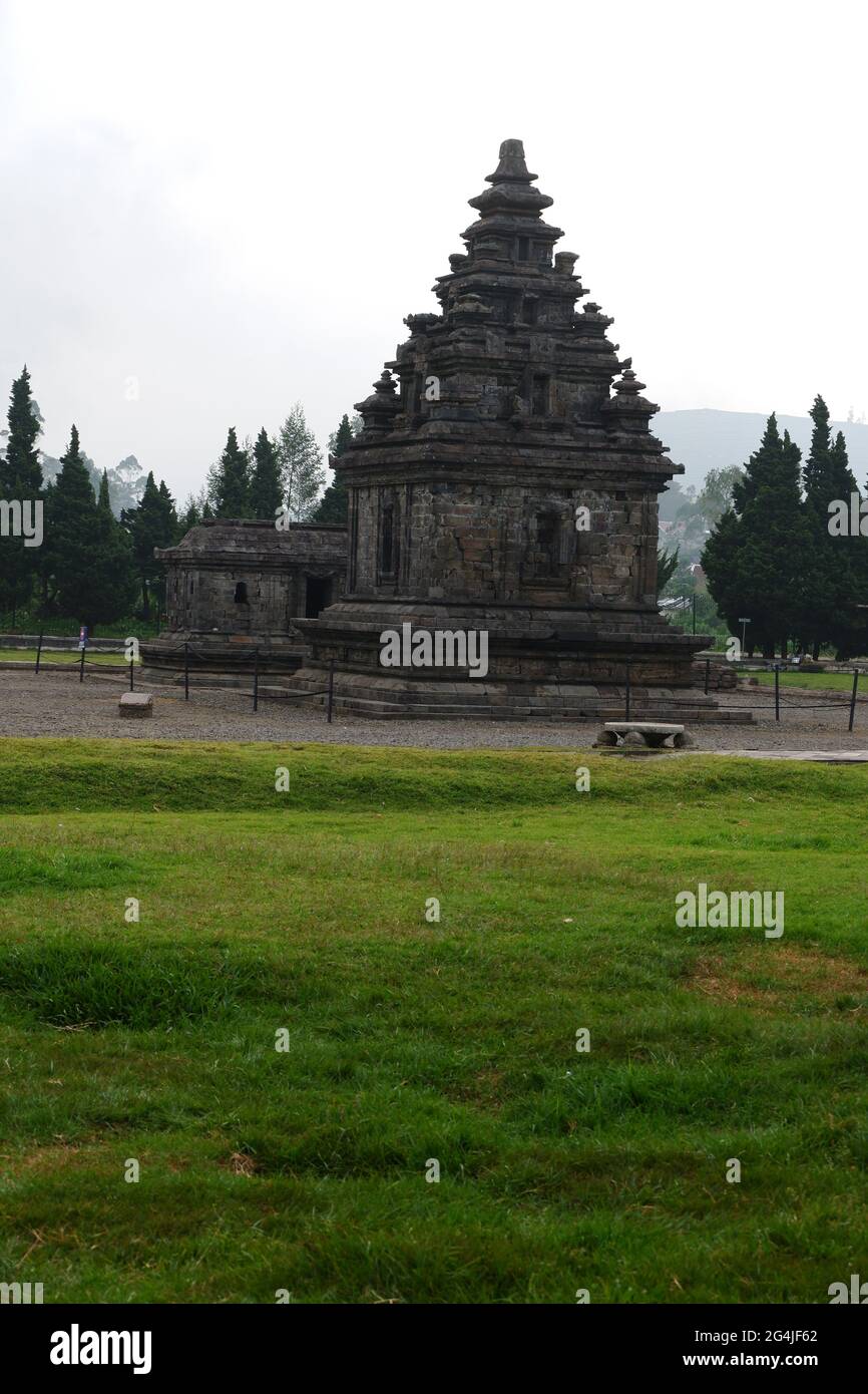 Vertical shot of the Arjuna and Semar temples in the Dieng temple compound, Indonesia Stock Photo