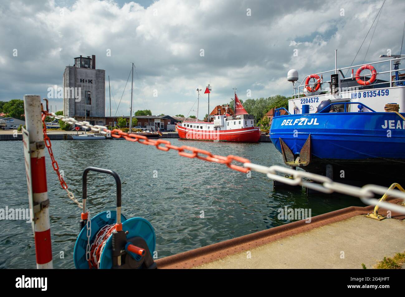 Fehmarn, Germany. 20th June, 2021. Cargo and transport ships are moored in a pier in the municipal port of Burgstaaken. The harbour basin is to be dredged to a depth of five metres to make the small port competitive again. (to dpa 'Fehmarn wants to deepen Burgstaaken municipal harbour') Credit: Gregor Fischer/dpa/Alamy Live News Stock Photo