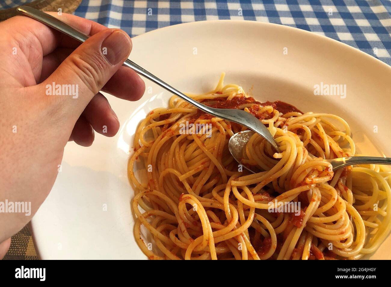 Berlin, Germany. 11th June, 2021. A man eats a Miracoli pasta dish. Pasta, basta More than half