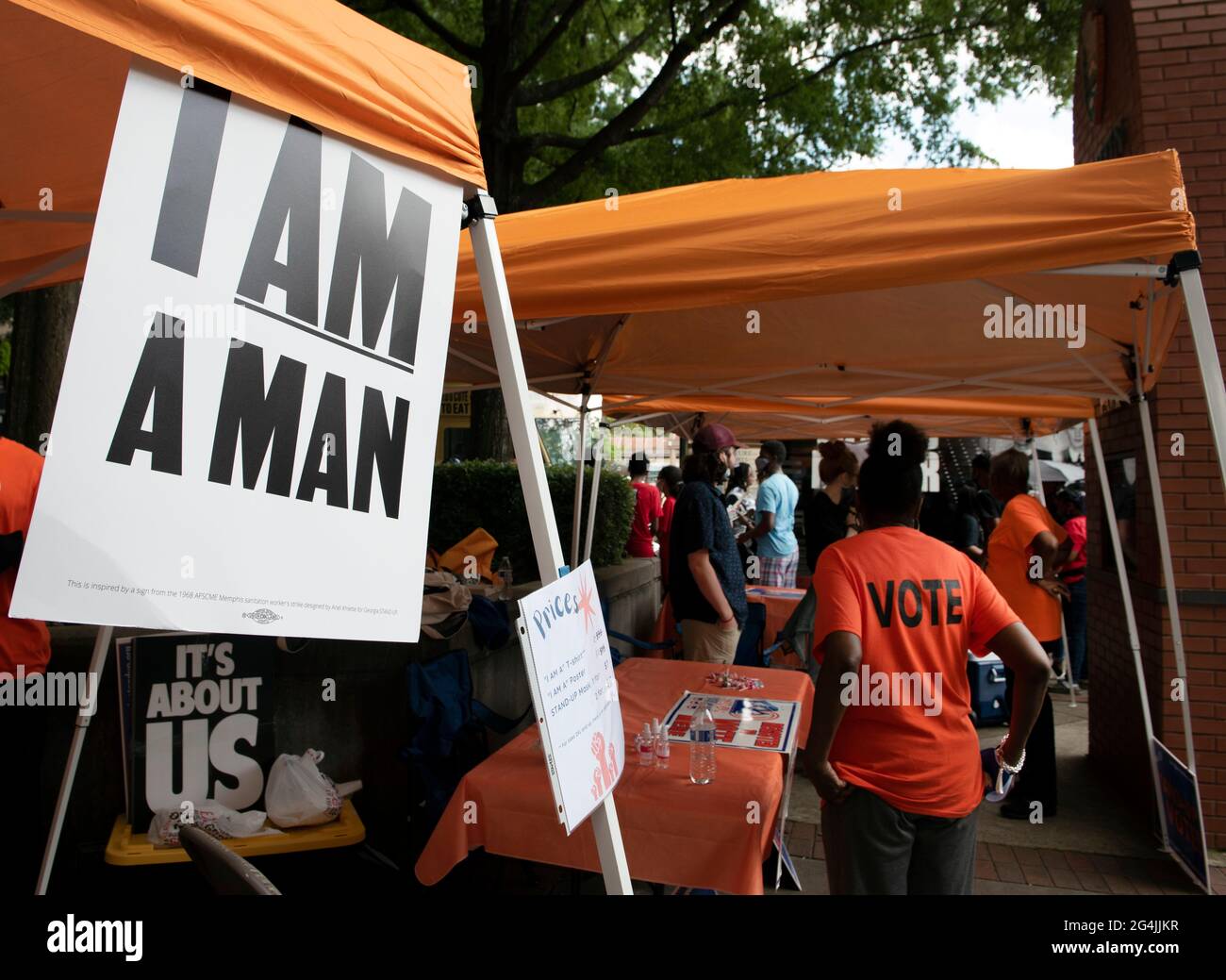 Atlanta, Georgia, USA. 21st June, 2021. A multi-bus Freedom Ride 2021 caravan for voting rights holds rally outside Ebenezer Baptist Church in Atlanta as momentum grows to fight GeorgiaÃs new voting laws which civil rights leaders say suppress voting rights for Black and low-income voters.Pictured: Voter registration volunteers registered several people at the rally. Credit: Robin Rayne/ZUMA Wire/Alamy Live News Stock Photo