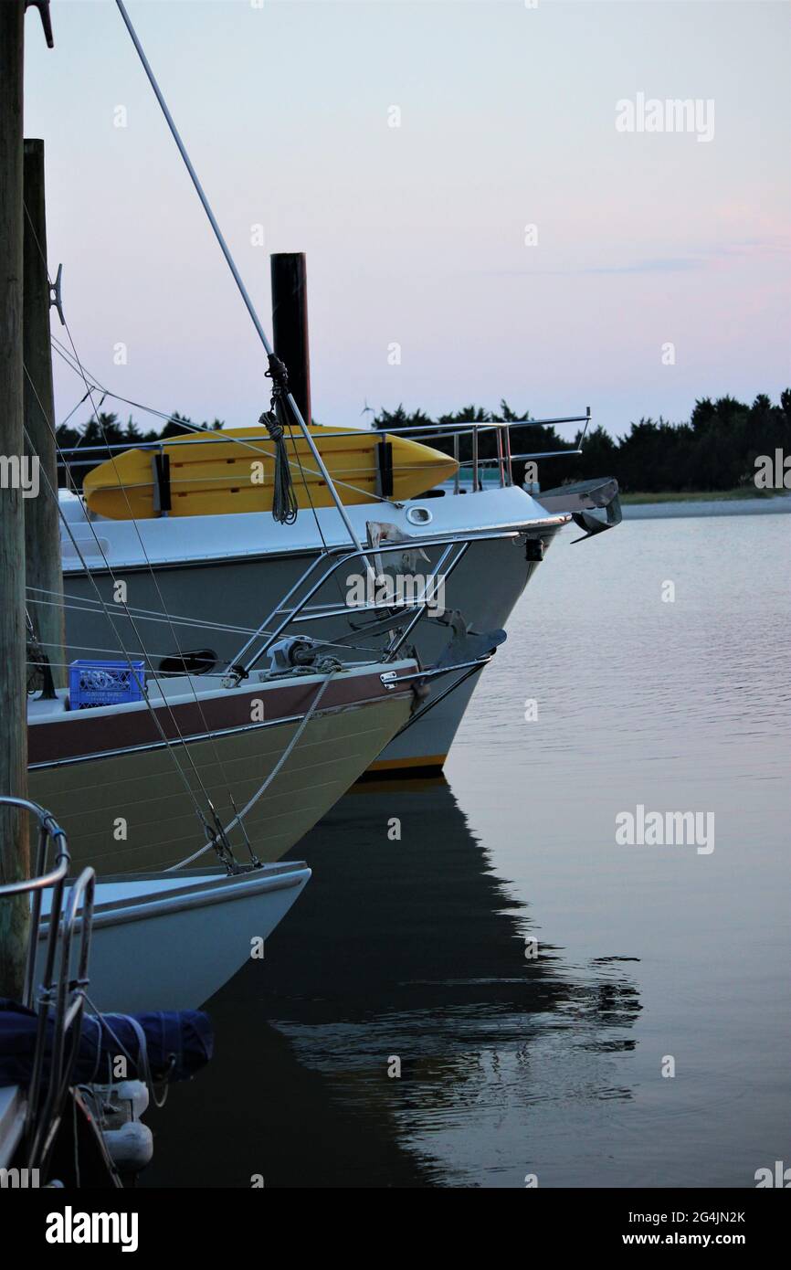 Boats tied at the pier in line Stock Photo - Alamy