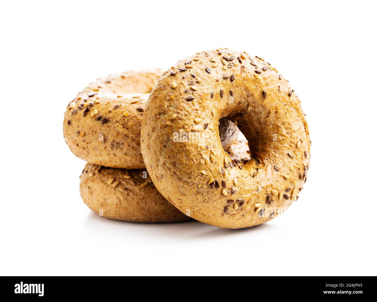 Whole grain baked bagel isolated on white background. Stock Photo