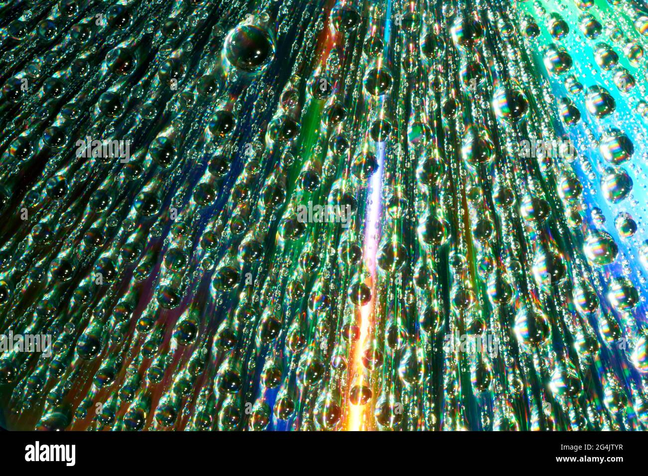 Macro of water drops on multicolor background Stock Photo - Alamy