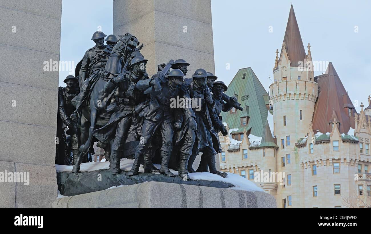 Bronze statue of soldiers, detail of the national war memorial on a winter day with snow, Ottawa, Canada, , designed by Vernon March Stock Photo