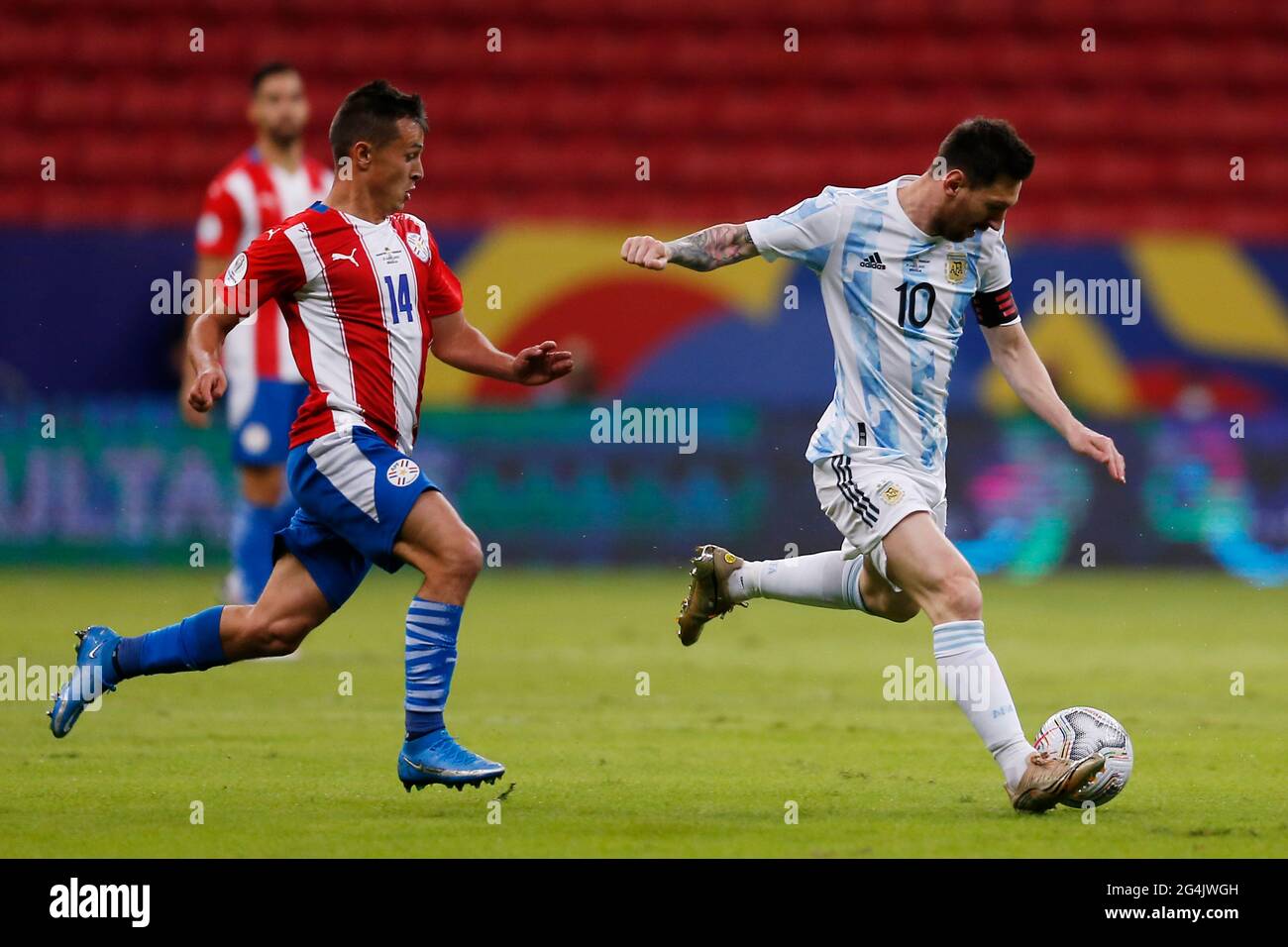Brasilia, Brazil. 21st June, 2021. Lionel Messi (R) of Argentina competes during the 2021 Copa America group A football match between Argentina and Paraguay in Brasilia, Brazil, on June 21, 2021. Credit: Lucio Tavora/Xinhua/Alamy Live News Stock Photo