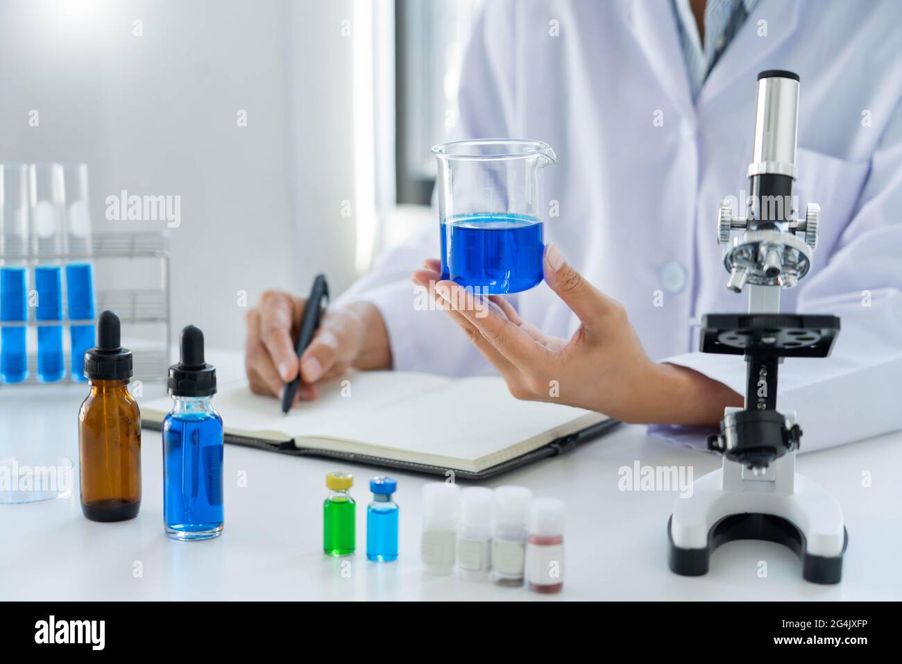Scientist wear lab coat and protective wear are working with research ...