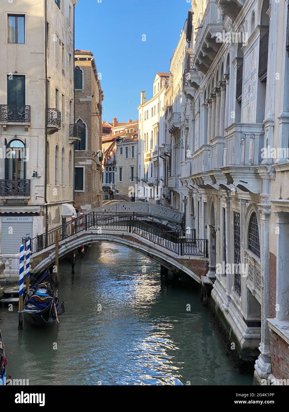 https://c8.alamy.com/comp/2G4K1PP/beautiful-bridge-over-a-small-canal-lined-on-colorful-building-background-venice-italy-during-lockdown-crisis-covid-19-2G4K1PP.jpg