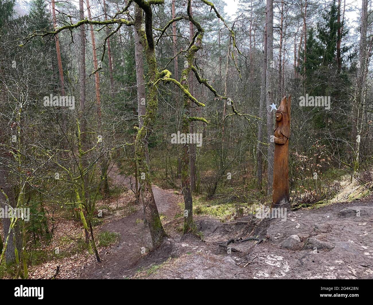 Wooden Sculpture of a fairy at the edge of the fairy path in Virton, Luxembourg, Belgium Stock Photo