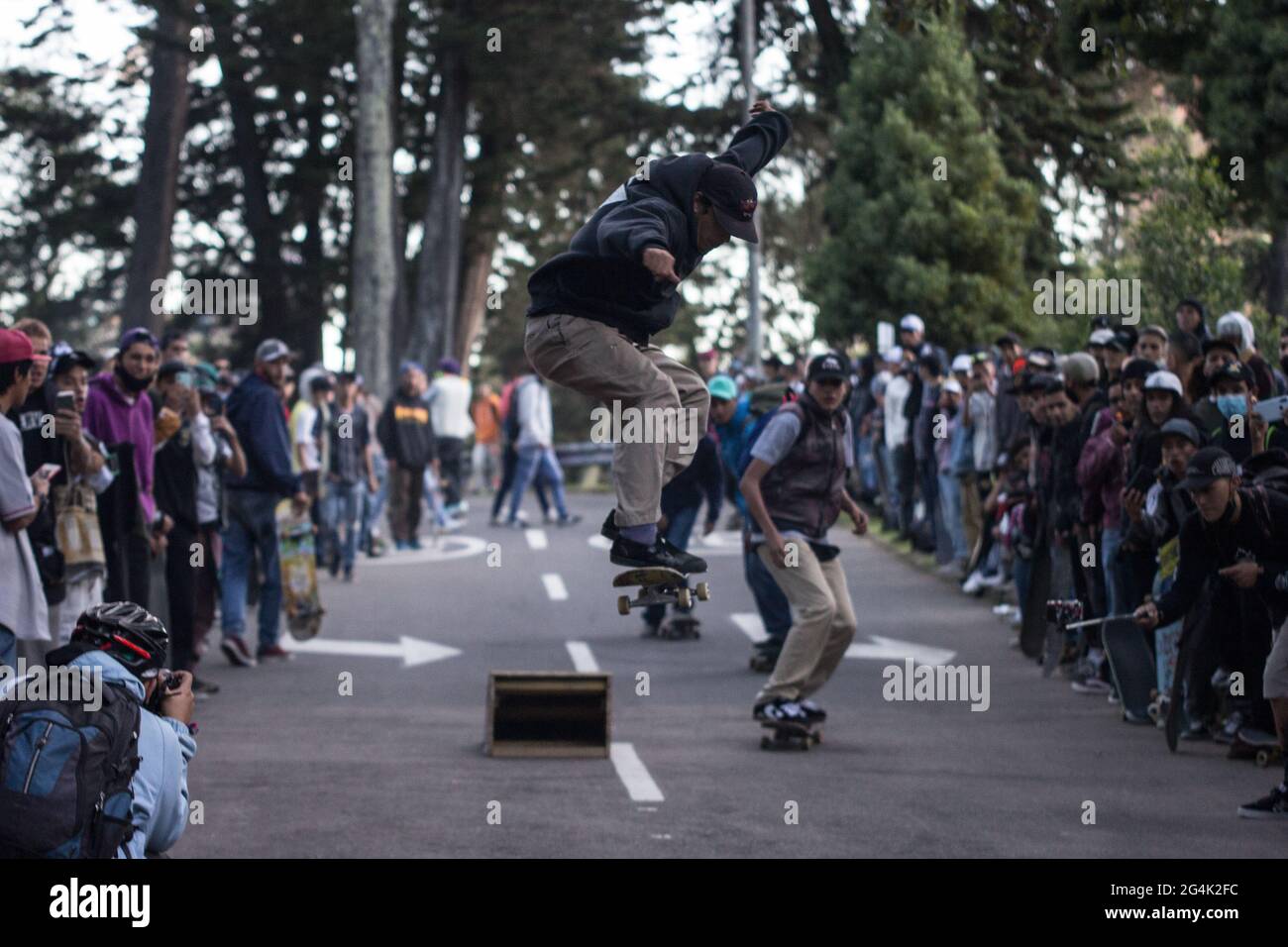 Skaters perform tricks on a ramp sitted on a main road during the  international World Skateboarding Day in Bogota, Colombia on June 21, 2021  Stock Photo - Alamy