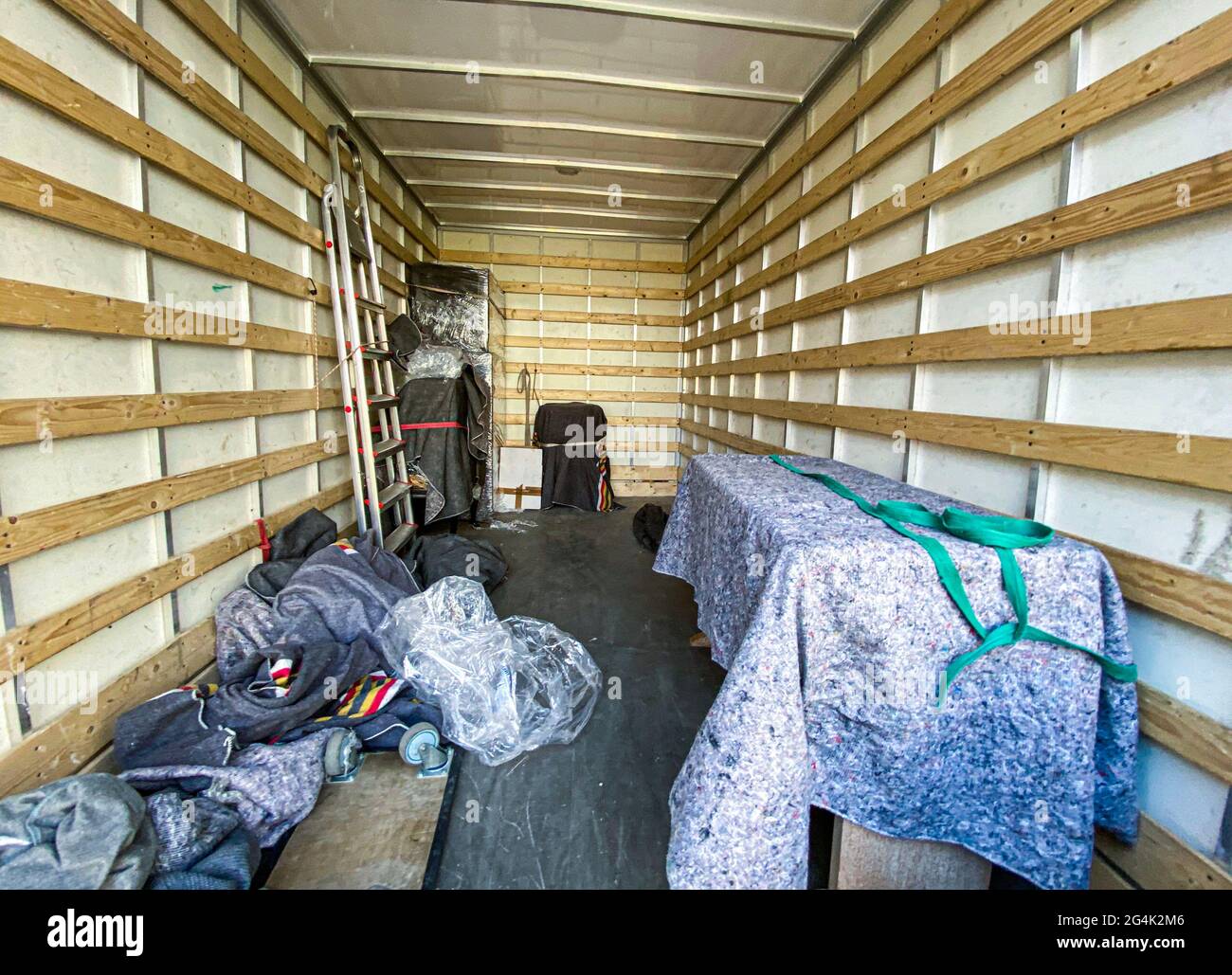 interior view of a moving truck full of items Stock Photo