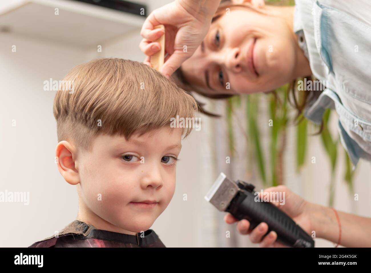young mom hairdresser cuts her baby boy at home with hair clipper during quarantine. selective focus. portrait Stock Photo - Alamy young mom hairdresser cuts her baby boy at home with hair clipper during quarantine. selective focus. portrait Stock Photo - Alamy