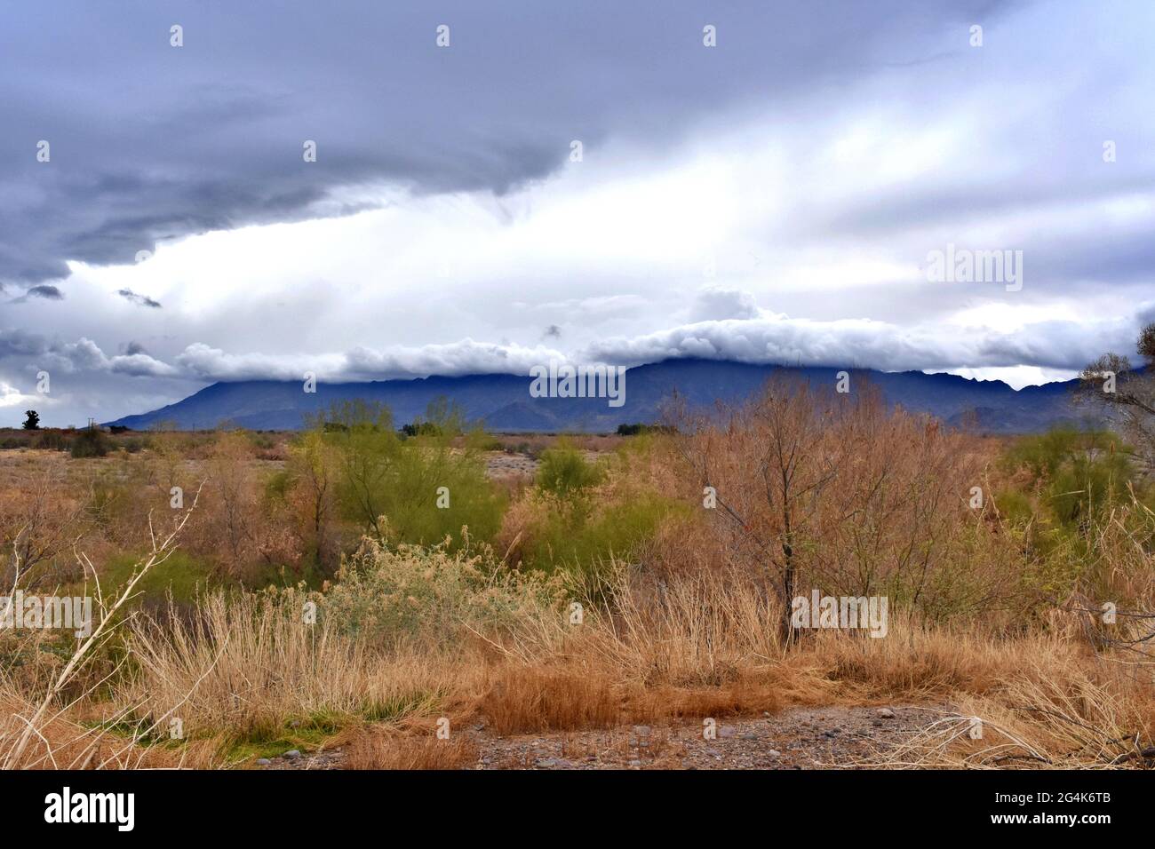 Foreboding storm clouds over a mountain top. Stock Photo