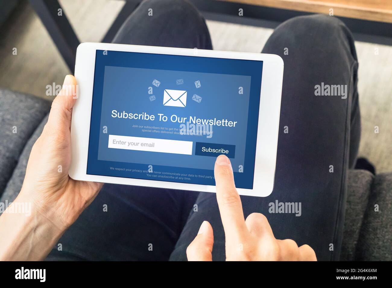 Subscribe to newsletter form on tablet computer screen to join list of susbscribers and receive exclusive offers and update. Digital communication mar Stock Photo