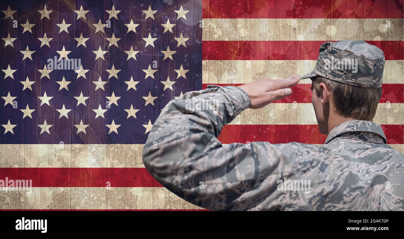 Composition of male soldier saluting over american flag Stock Photo - Alamy