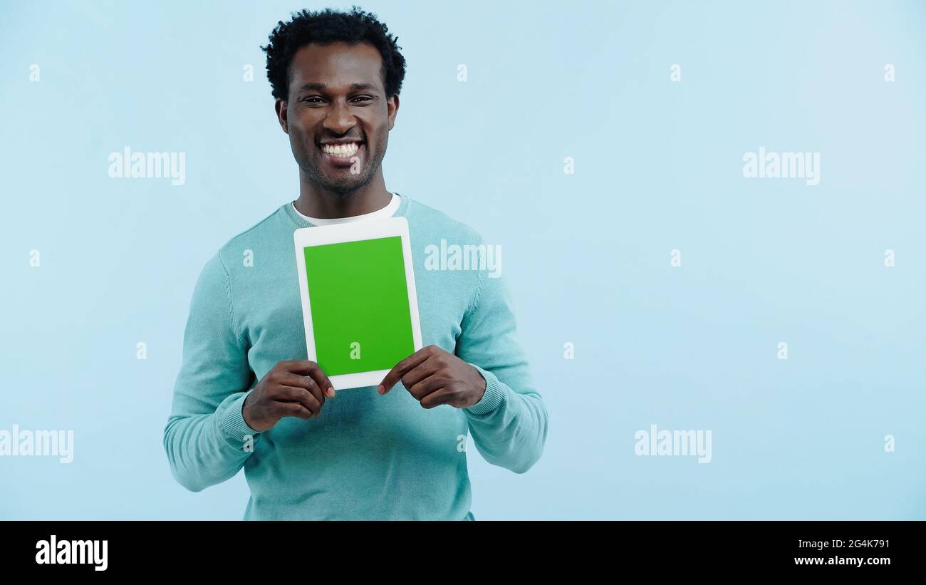 happy african american man holding digital tablet with green screen ...