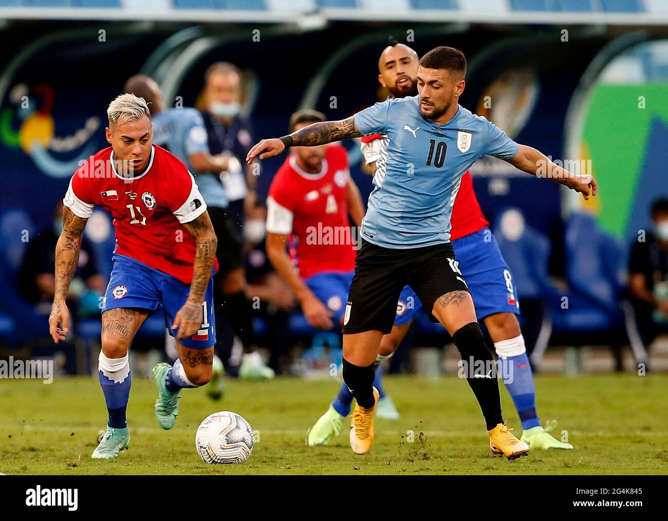 CUIABA, BRAZIL - JUNE 21: Eduardo Vargas of Chile competes for the ball with Giorgian De Arrascaeta of Uruguay ,during the match between Uruguay and Chile as part of Conmebol Copa America Brazil 2021 at Arena Pantanal on June 21, 2021 in Cuiaba, Brazil. (MB Media) Stock Photo