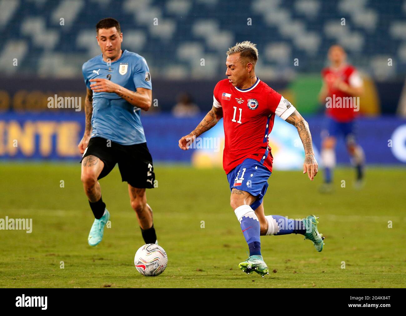 CUIABA, BRAZIL - JUNE 21: Eduardo Vargas of Chile competes for the ball with Jose Gimenez of Uruguay ,during the match between Uruguay and Chile as part of Conmebol Copa America Brazil 2021 at Arena Pantanal on June 21, 2021 in Cuiaba, Brazil. (MB Media) Stock Photo