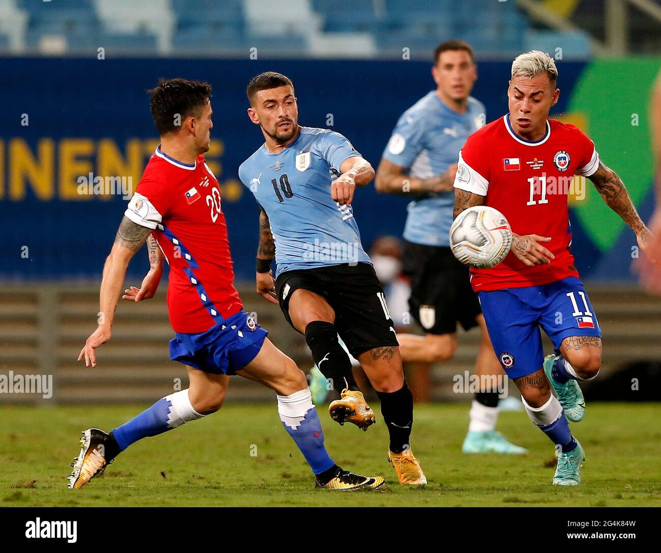 CUIABA, BRAZIL - JUNE 21: Giorgian De Arrascaeta of Uruguay competes for the ball with Charles Aranguiz and Eduardo Vargas of Chile ,during the match between Uruguay and Chile as part of Conmebol Copa America Brazil 2021 at Arena Pantanal on June 21, 2021 in Cuiaba, Brazil. (MB Media) Stock Photo