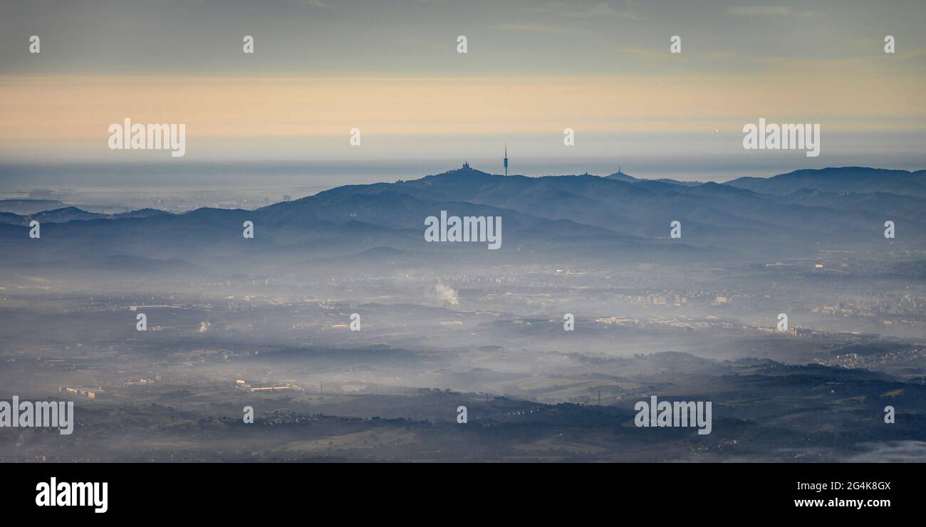 Aerial view of the Collserola mountain range and the Vallès plain with mist (Barcelona, Catalonia, Spain) ESP: Vistas aéreas de Collserola y el Vallès Stock Photo