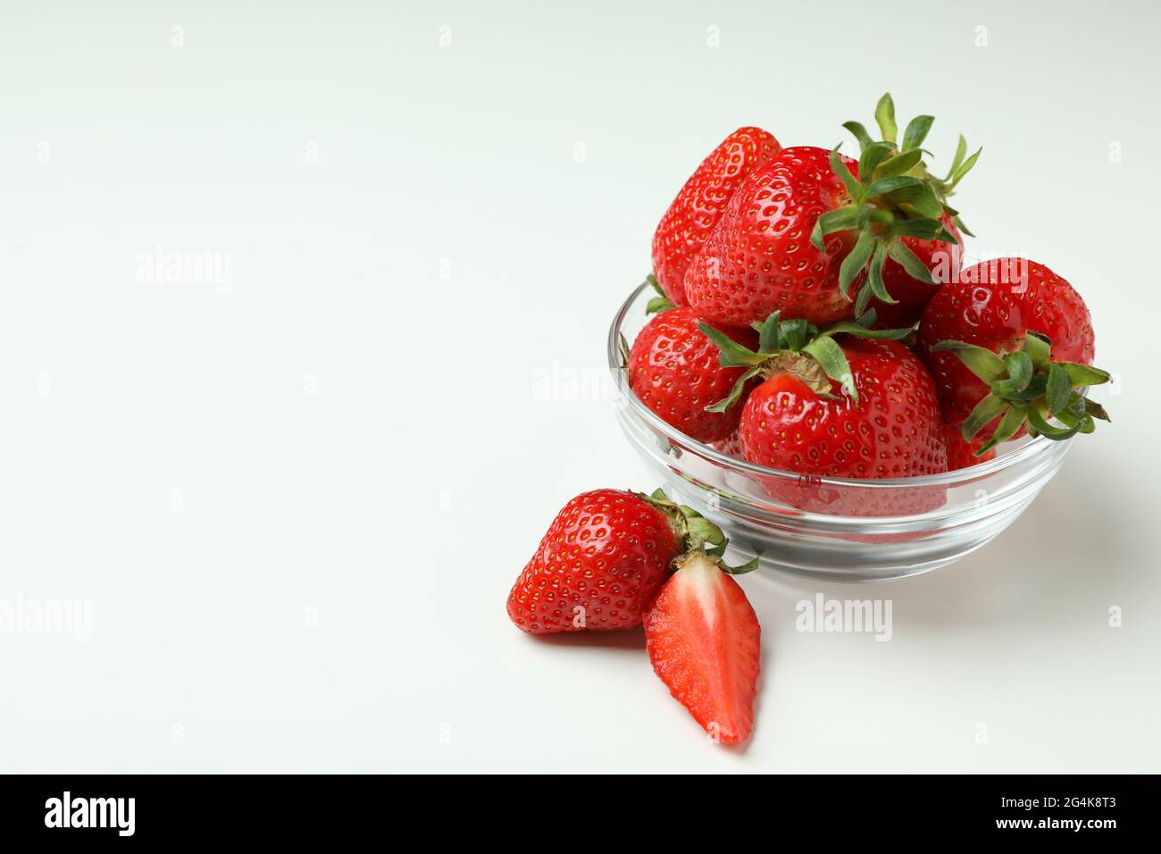 Bowl of fresh strawberry on white background Stock Photo - Alamy