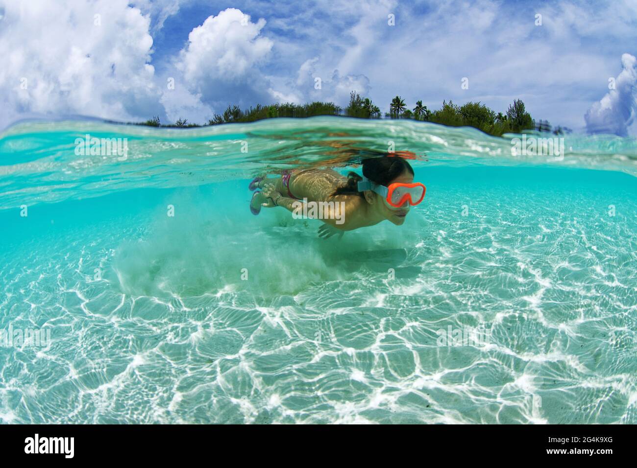 Tahiti, French Polynesia, Moorea child in the water, snorkeling
