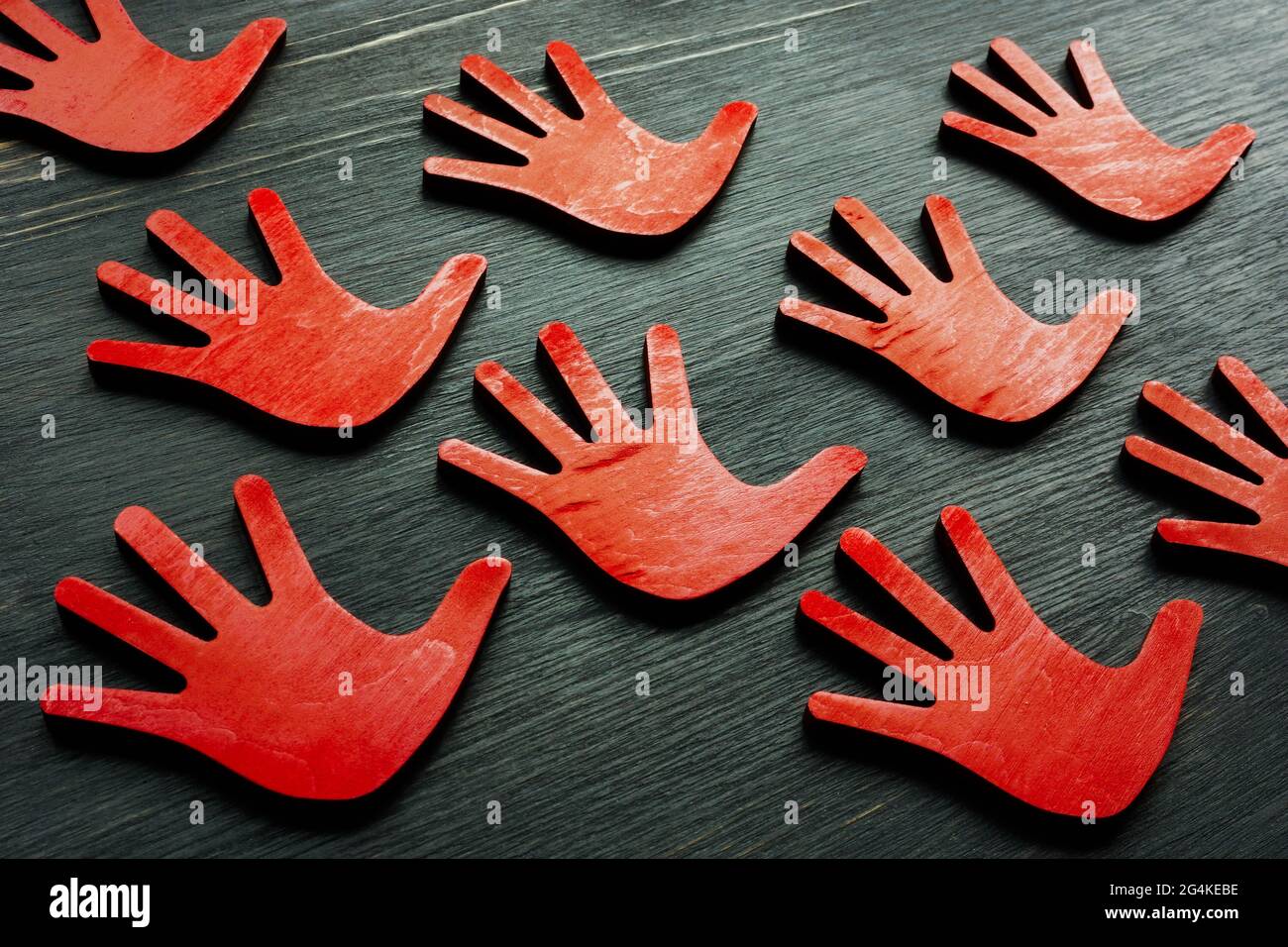 Red palms as a sign of protest or stop concept. Stock Photo