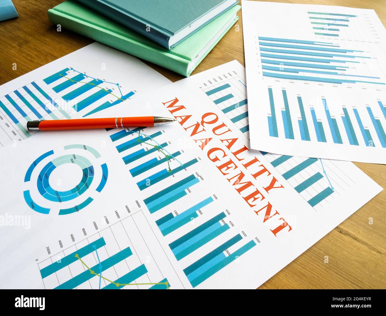 Quality management report with data and pen. Stock Photo