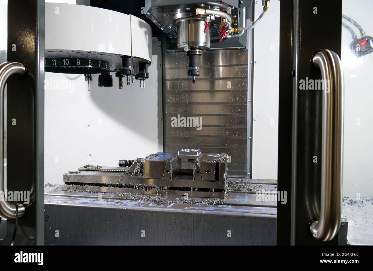 Automatic milling machine after the production of the part in the factory. Stock Photo
