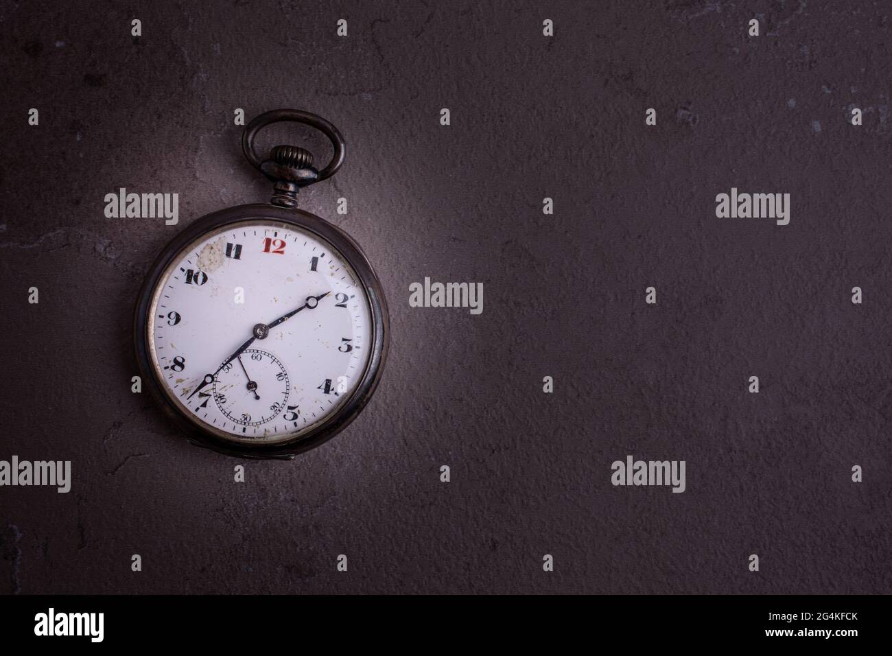 Old pocket watch on dark background with copy space Stock Photo