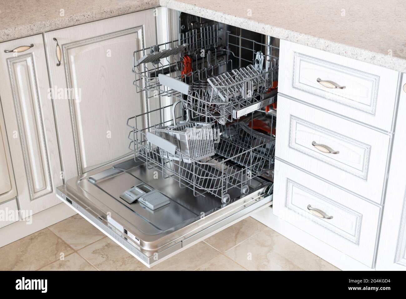 opened new empty dishwasher machine in the kitchen Stock Photo Alamy