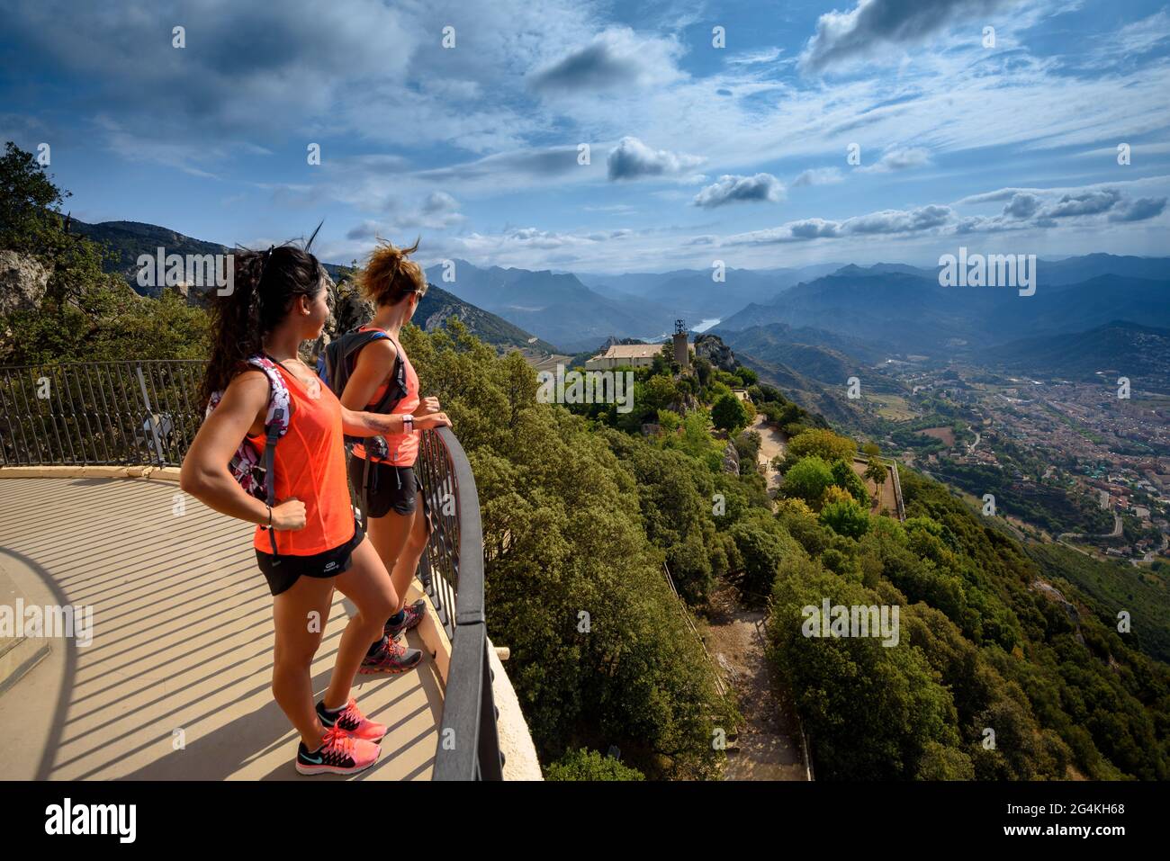 Two people at the viewpoint of the Queralt sanctuary, called the 'Balcony of Catalonia', looking at the views towards Berga (BCN, Catalonia, Spain) Stock Photo