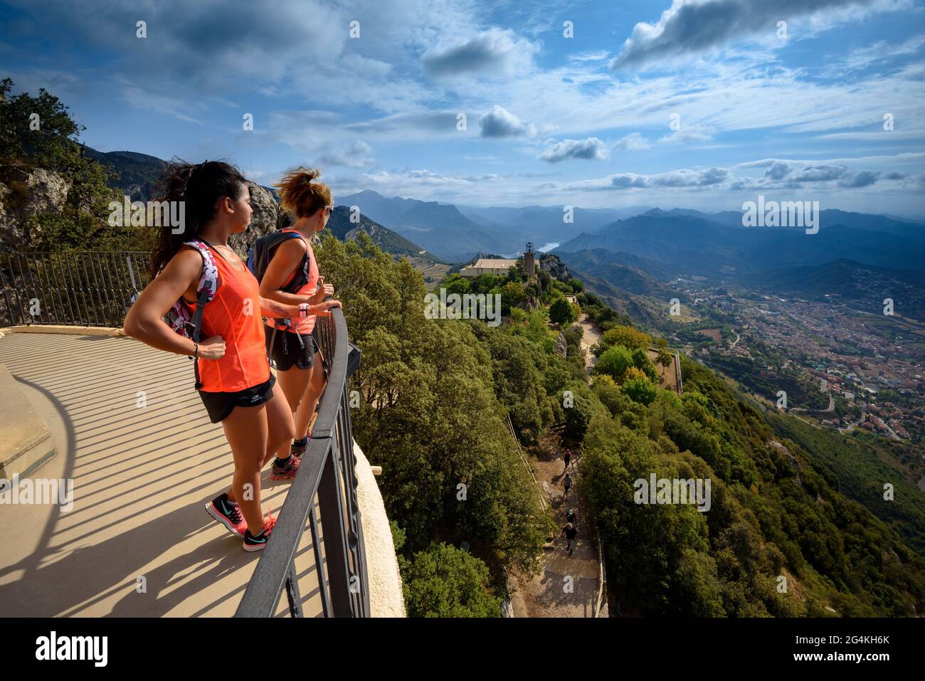 Two people at the viewpoint of the Queralt sanctuary, called the 'Balcony of Catalonia', looking at the views towards Berga (BCN, Catalonia, Spain) Stock Photo