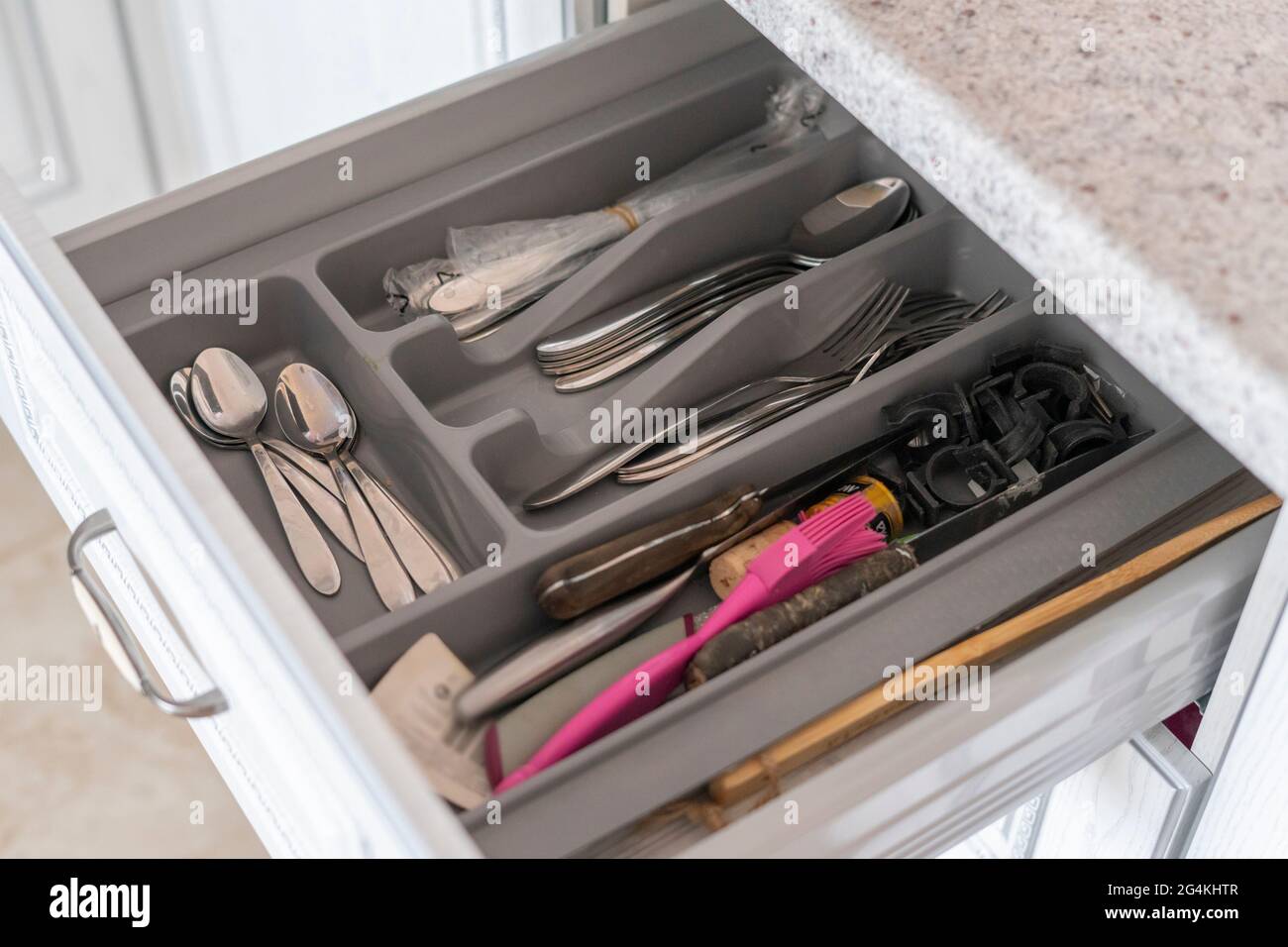 a kitchen accessories storage solutions, some dish and tablewear in the