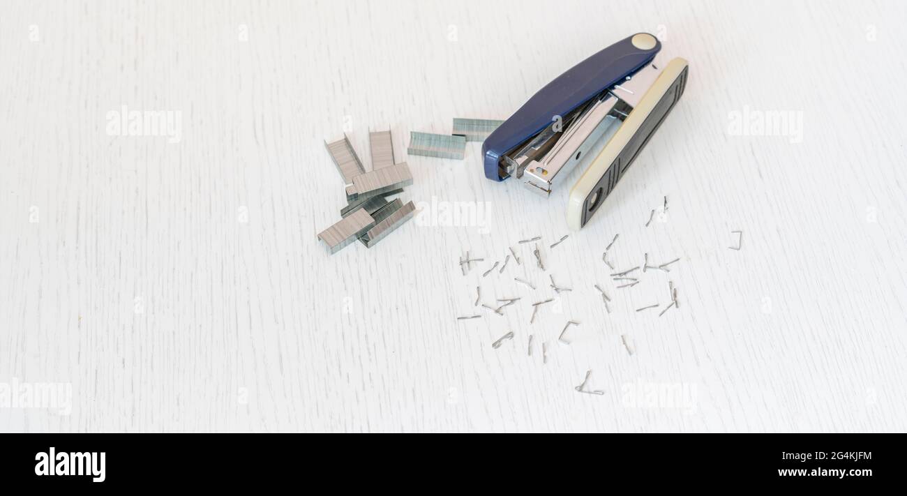 simple stapler and staples isolated on the colorful background in