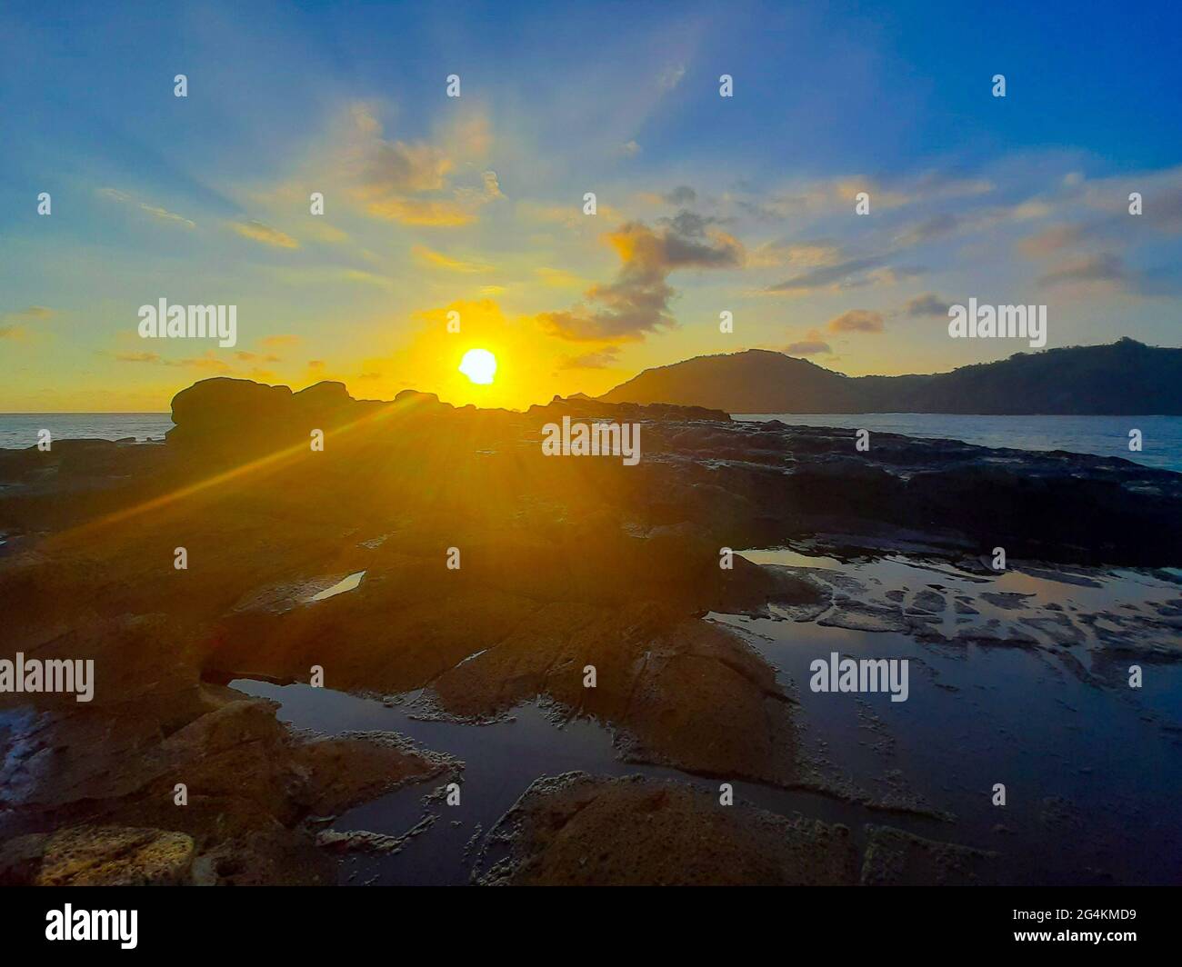 Beautiful sunbeam on extreme terrain from a rocky coast Stock Photo - Alamy