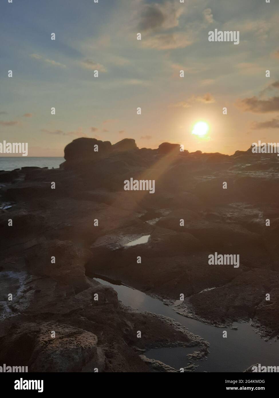 Beautiful sunbeam on extreme terrain from a rocky coast Stock Photo - Alamy