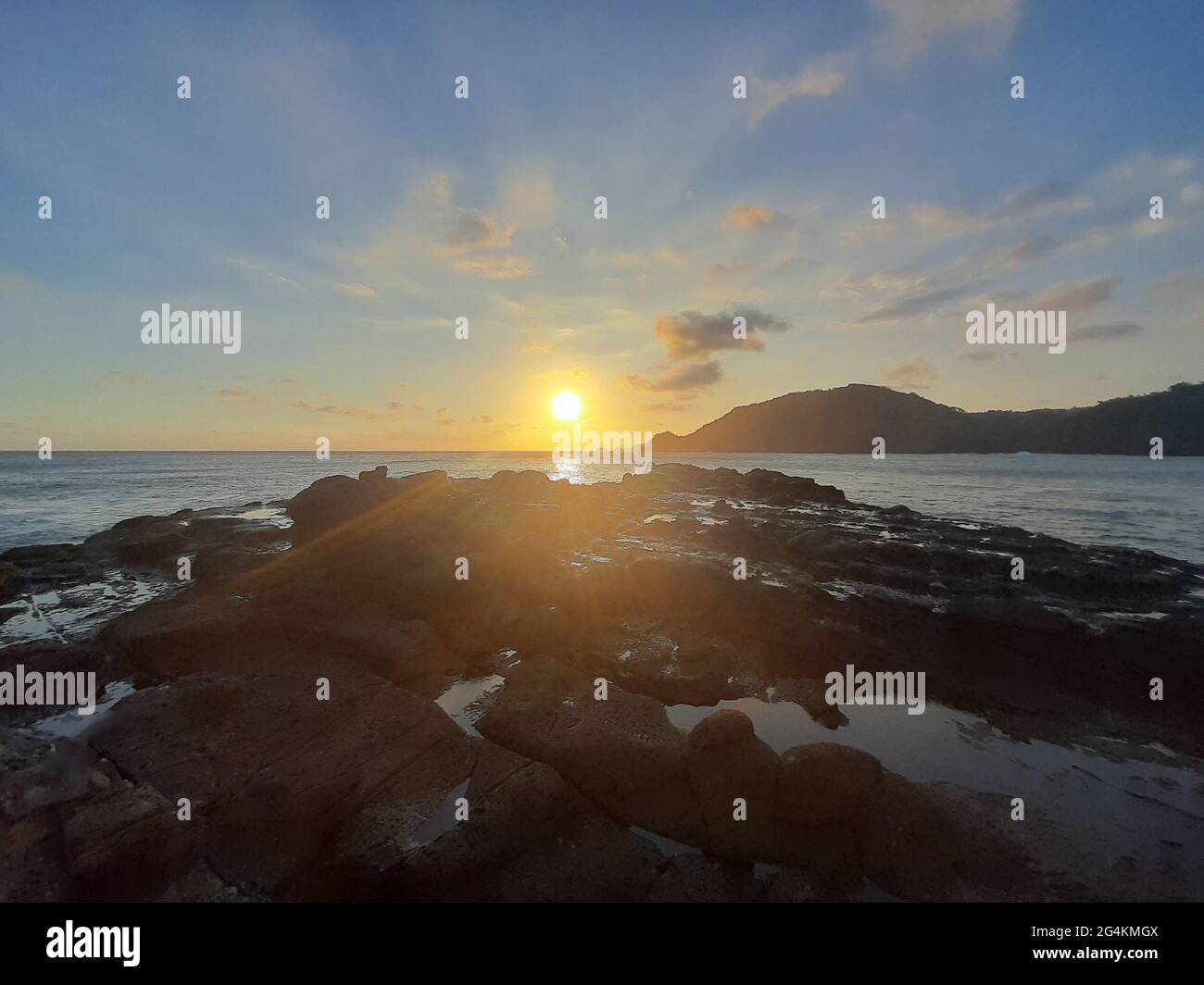Beautiful sunbeam on extreme terrain from a rocky coast Stock Photo - Alamy