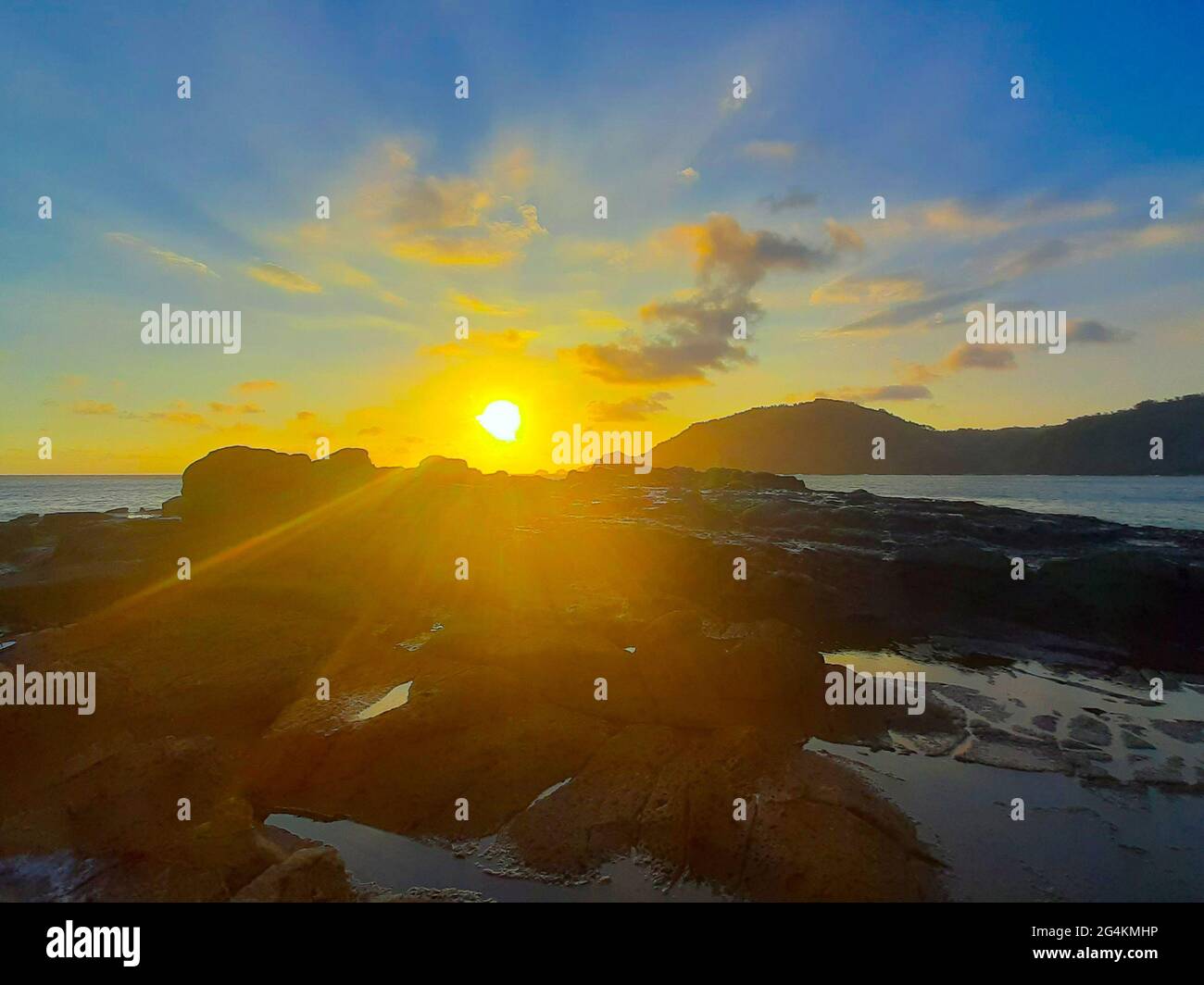 Beautiful sunbeam on extreme terrain from a rocky coast Stock Photo - Alamy