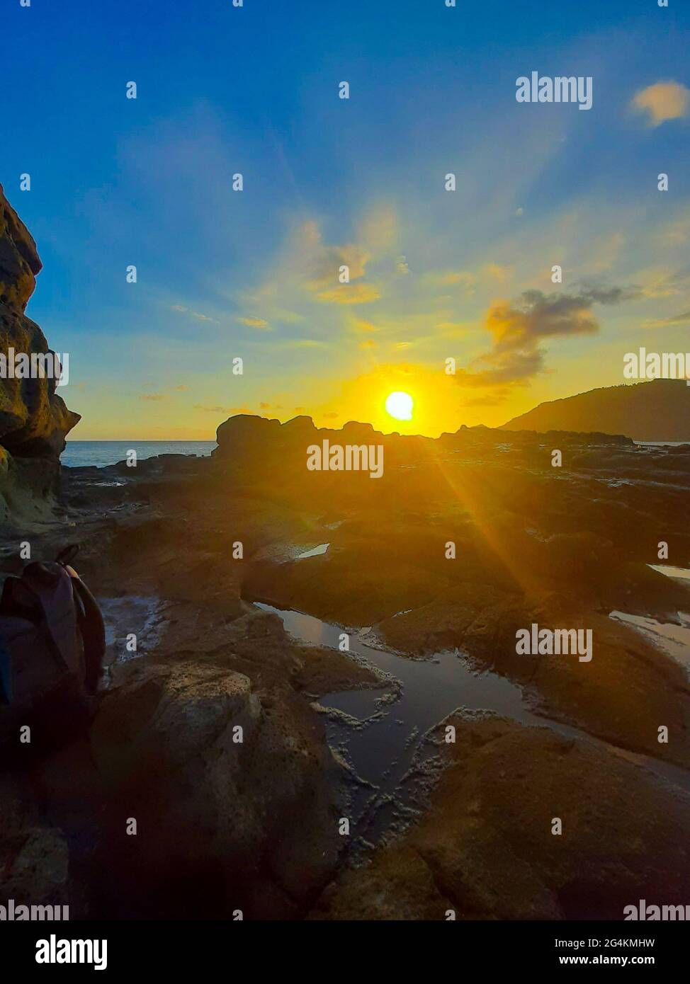 Beautiful sunbeam on extreme terrain from a rocky coast Stock Photo - Alamy