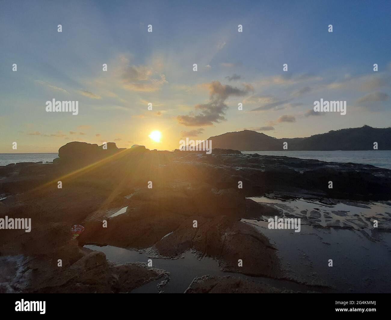 Beautiful sunbeam on extreme terrain from a rocky coast Stock Photo - Alamy
