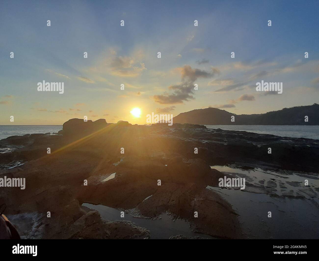 Beautiful sunbeam on extreme terrain from a rocky coast Stock Photo - Alamy