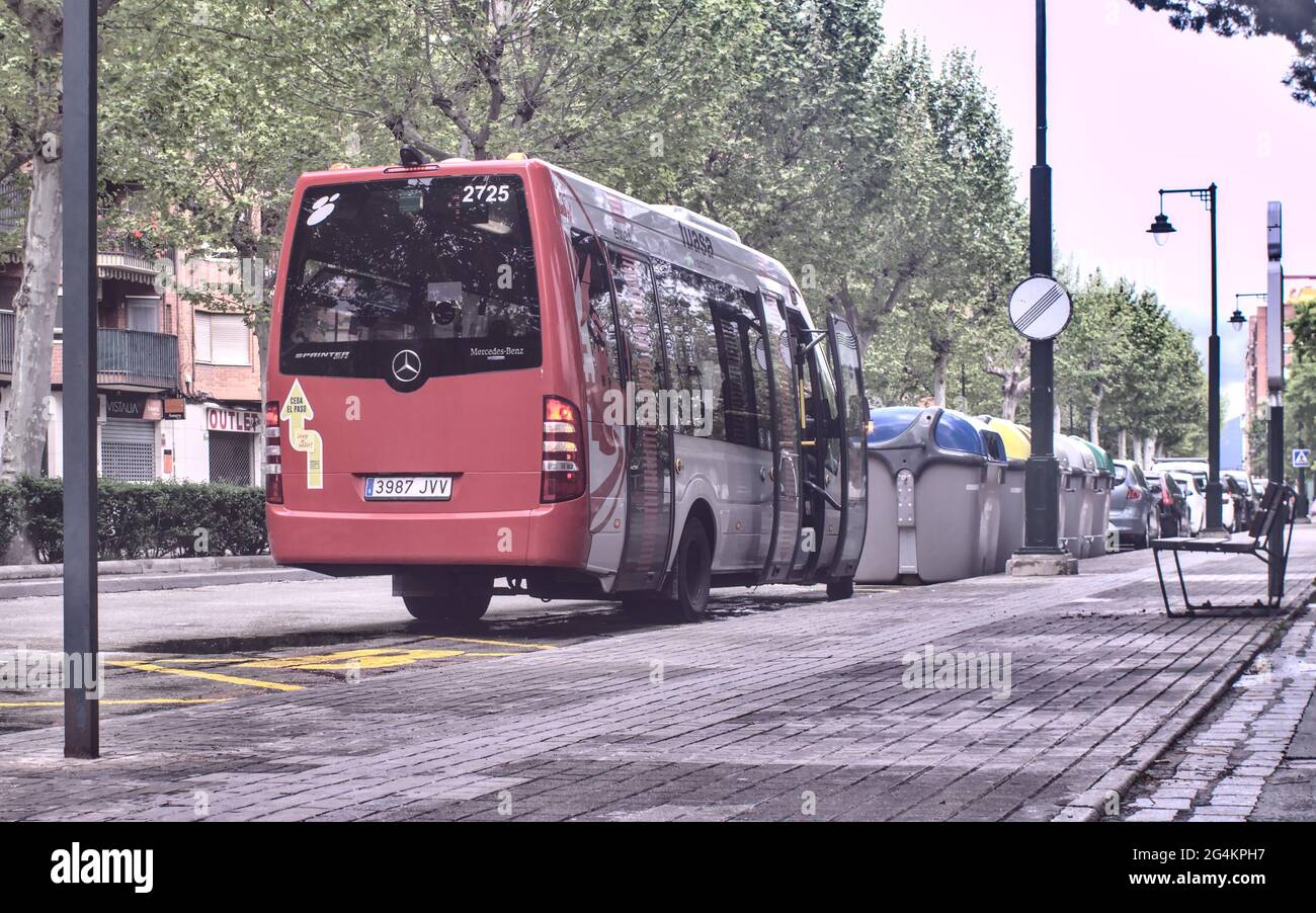 ALCOY, SPAIN - Apr 22, 2021: Alcoy, Alicante, Spain - April 2021. Red bus  stopped with doors opened at the bus stop next to selective containers for  r Stock Photo - Alamy