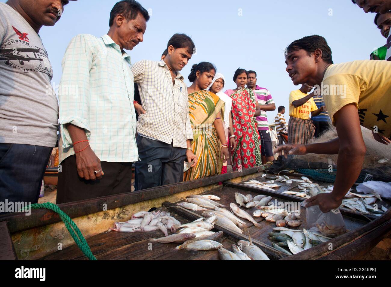 Fishing activities by local fishermen at Puri, Odisha, the most popular  tourist sea beach of eastern India. Tourists are enjoying and buying fish  Stock Photo - Alamy